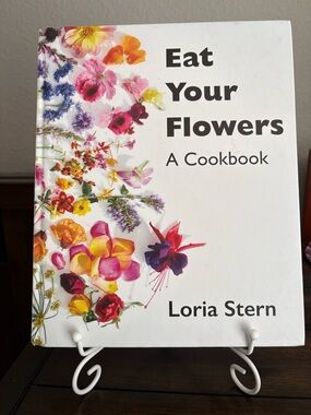 Eat Your Flowers A Cookbook with white book stand